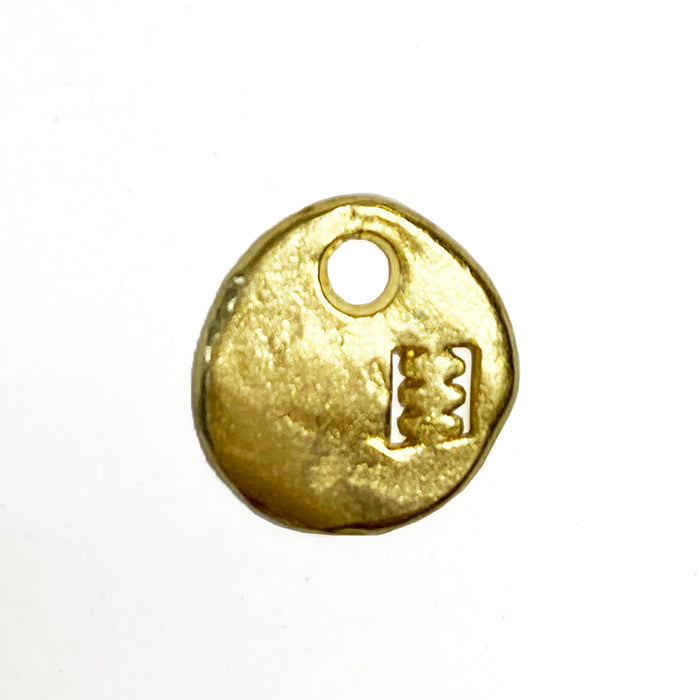 Brass charm with Cramp logo